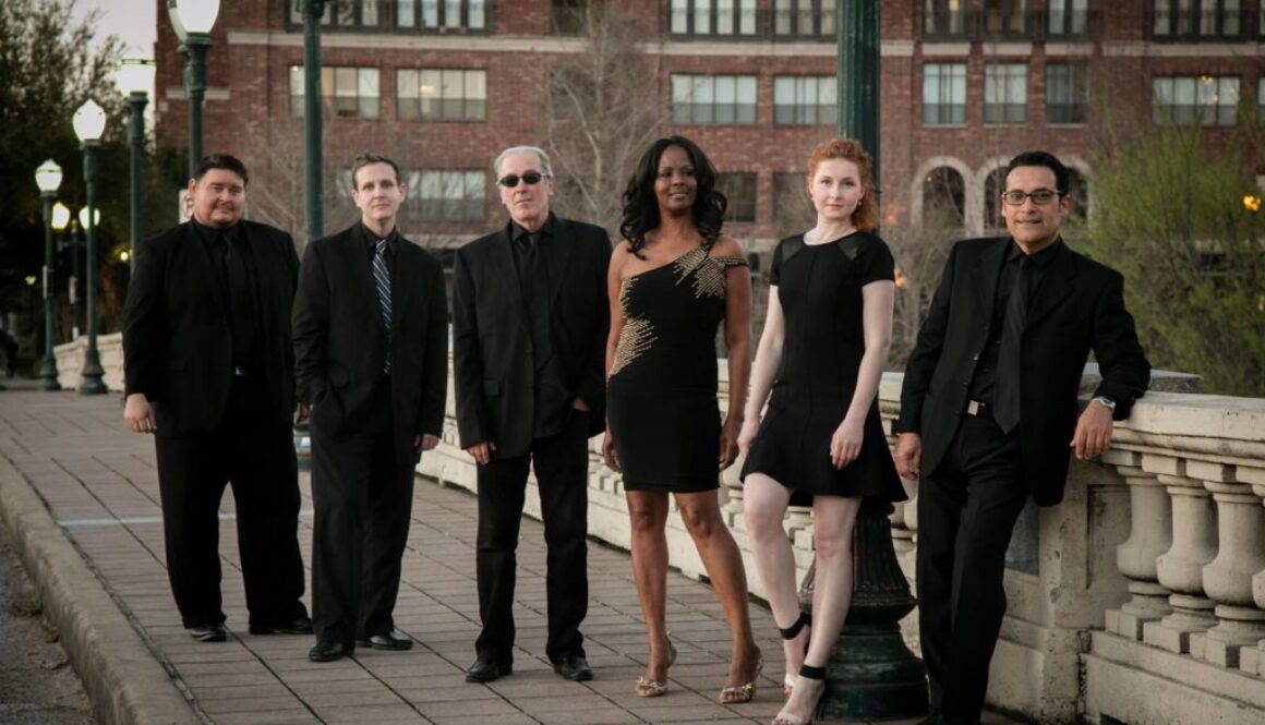A group of people standing next to each other.