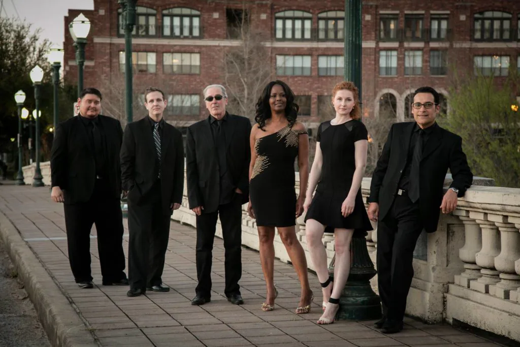 A group of people standing next to each other.
