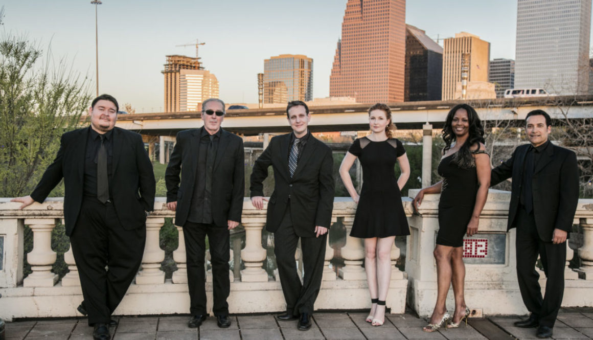 A group of people standing on top of a building.
